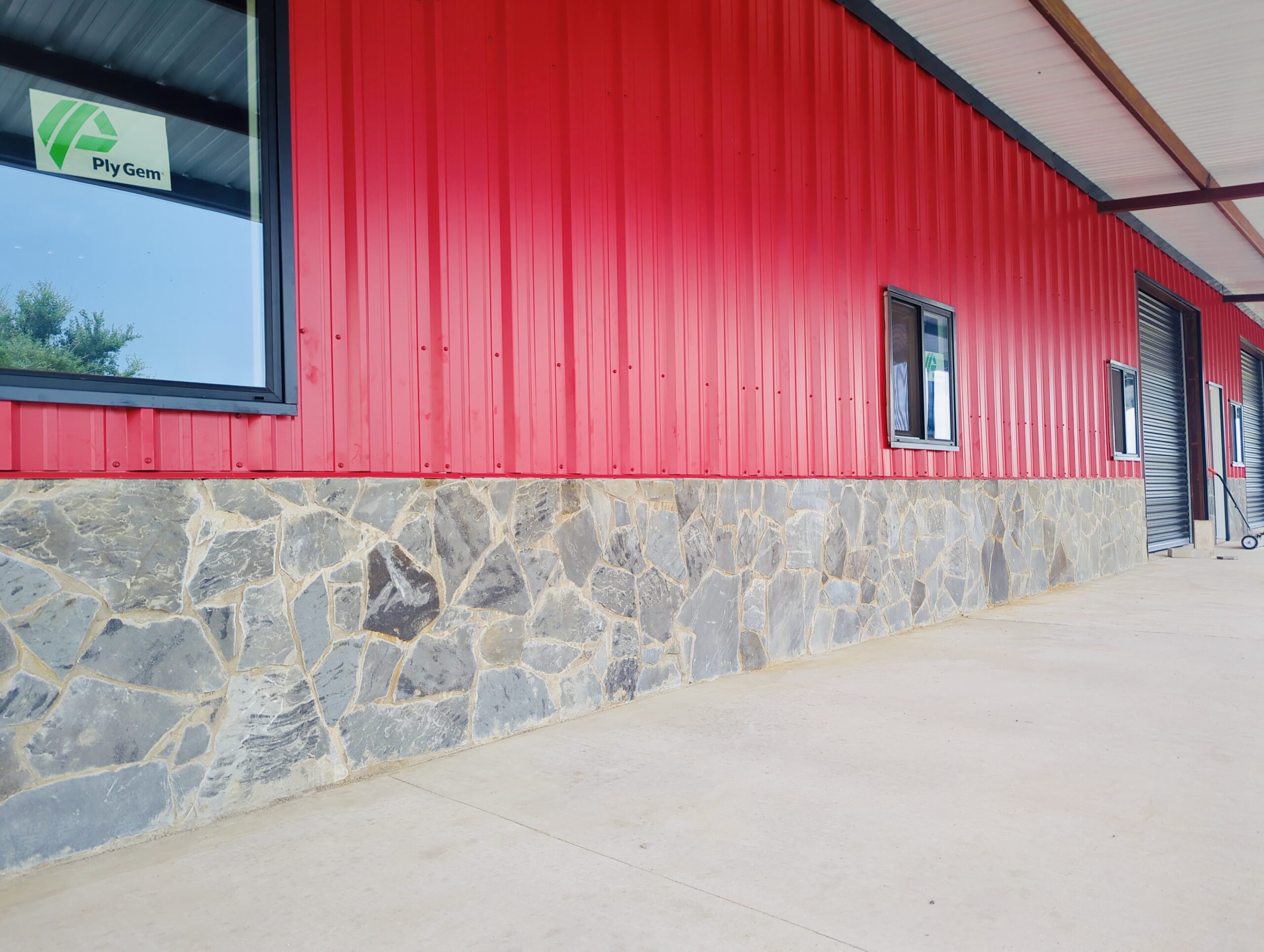 IMG_20240722_120150_100 | Trinity Properties Red tin wall with stone wainscot